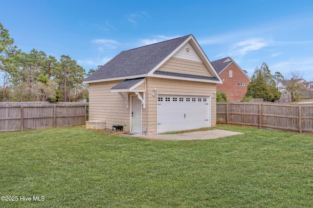 detached garage featuring fence