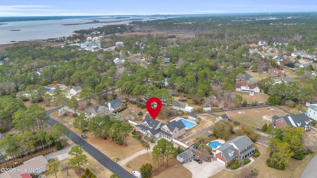 birds eye view of property featuring a residential view and a water view