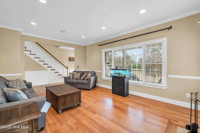 living area with stairway, wood finished floors, crown molding, recessed lighting, and baseboards