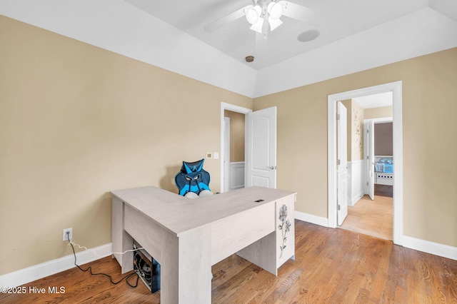 office area with light wood-type flooring, baseboards, and a ceiling fan