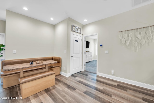 bathroom with recessed lighting, wood finished floors, visible vents, and baseboards