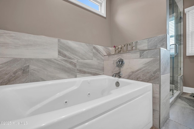 full bath with marble finish floor, a tub with jets, and a stall shower