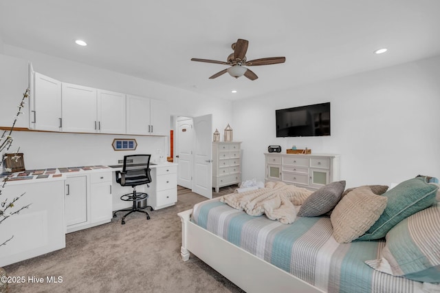 bedroom featuring an office area, recessed lighting, light carpet, and ceiling fan
