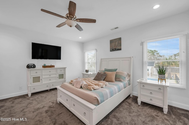bedroom featuring carpet floors, multiple windows, baseboards, and recessed lighting