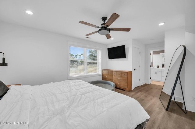 bedroom featuring a ceiling fan, visible vents, wood finished floors, baseboards, and recessed lighting