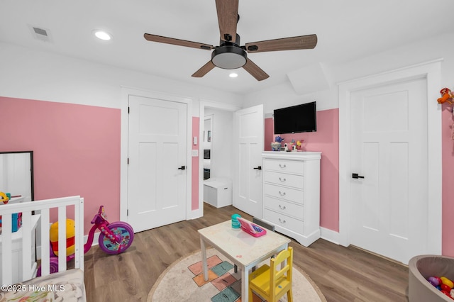 playroom featuring recessed lighting, visible vents, wood finished floors, and a ceiling fan