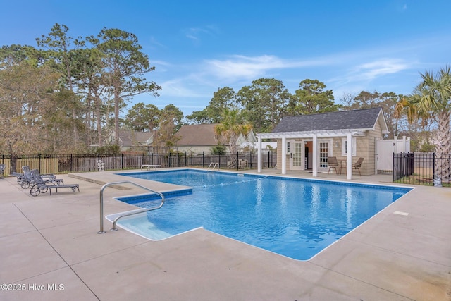 view of swimming pool with a fenced in pool, an outdoor structure, a patio, and fence