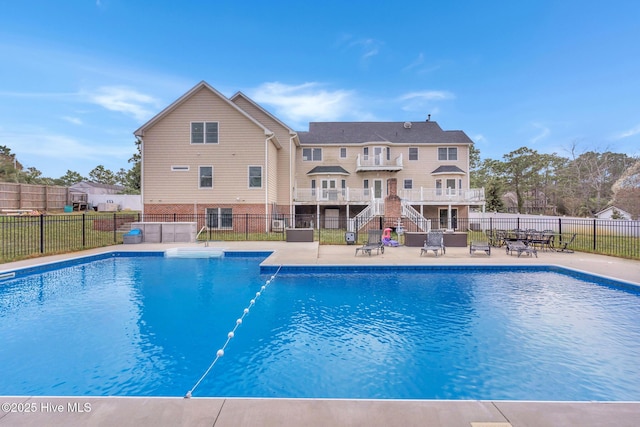 view of swimming pool featuring a fenced in pool, a patio, and fence