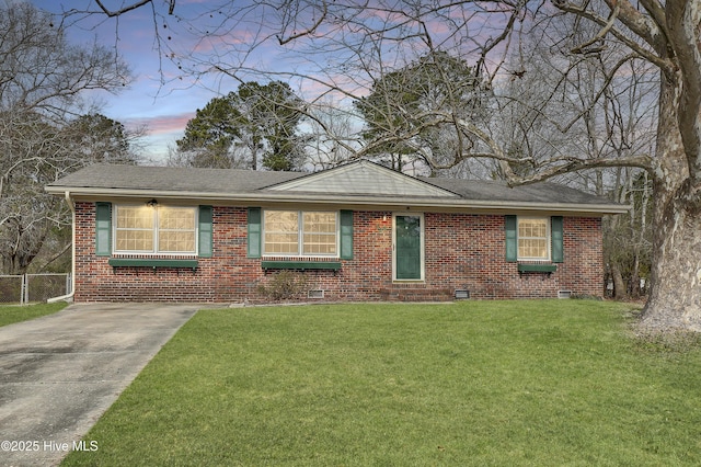 single story home featuring brick siding, a shingled roof, fence, crawl space, and a front lawn