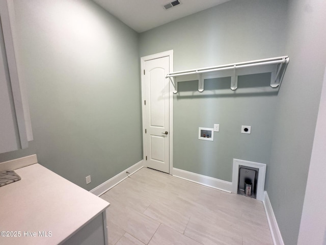 washroom featuring laundry area, washer hookup, electric dryer hookup, and baseboards