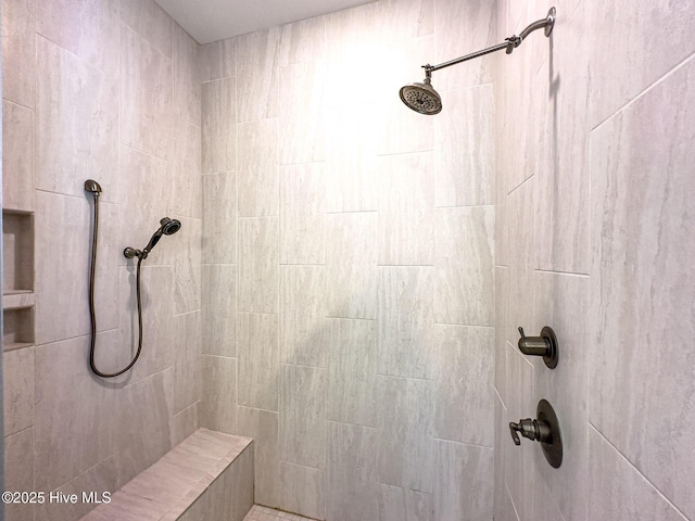 bathroom with a tile shower