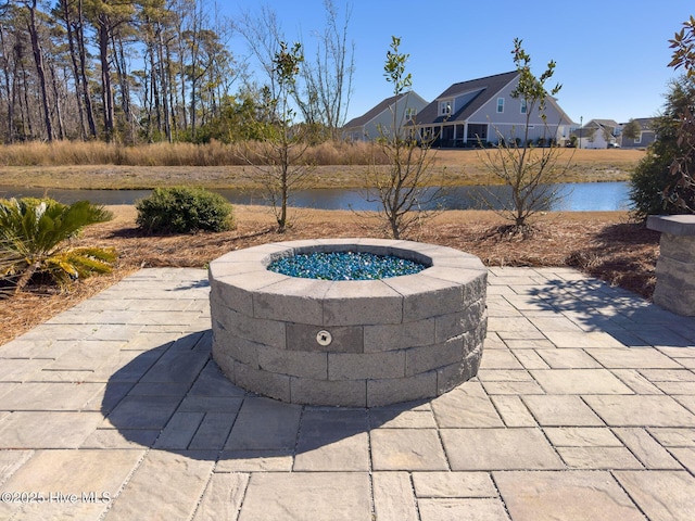 view of patio featuring a water view