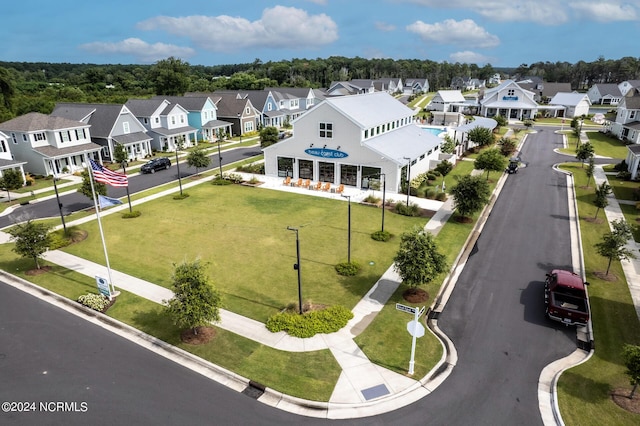 birds eye view of property with a residential view