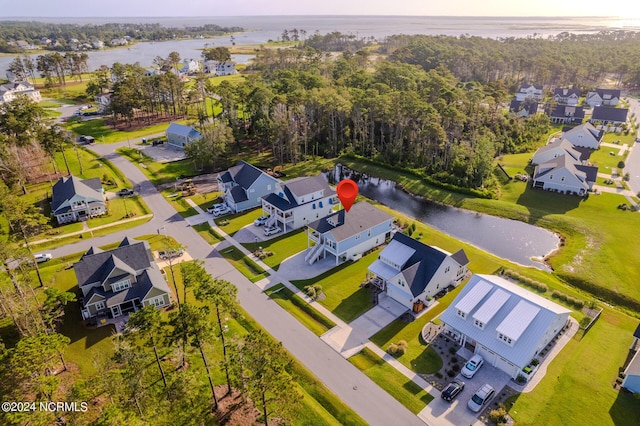 birds eye view of property featuring a water view and a residential view