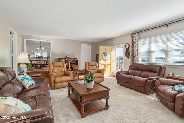 living area featuring plenty of natural light and carpet