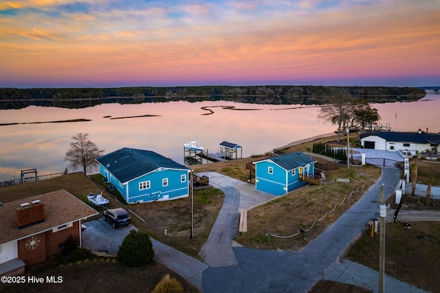 birds eye view of property featuring a water view