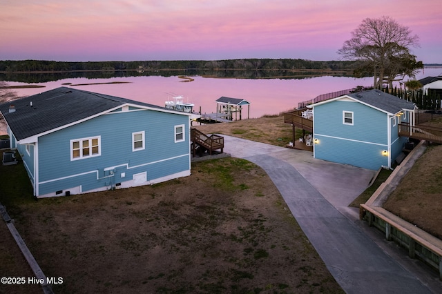 aerial view at dusk with a water view