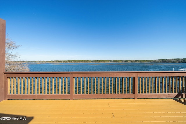 wooden deck with a water view