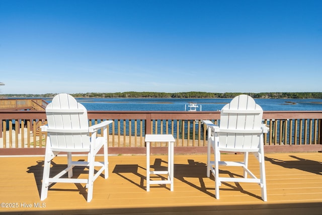 wooden deck featuring a water view