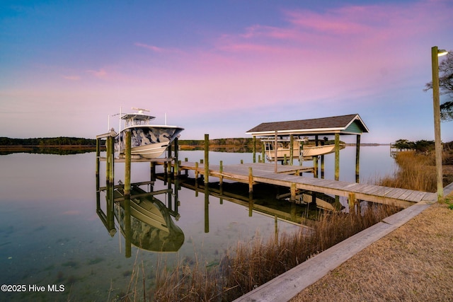 dock area with a water view and boat lift