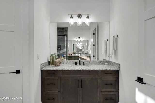 full bath featuring a shower stall and vanity