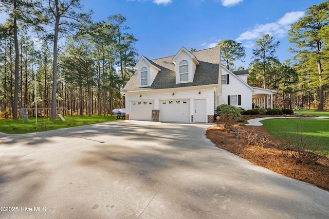 view of property exterior featuring a garage, concrete driveway, roof with shingles, and a lawn