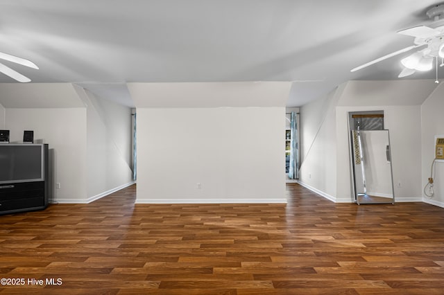 bonus room featuring ceiling fan, dark wood-style floors, and baseboards