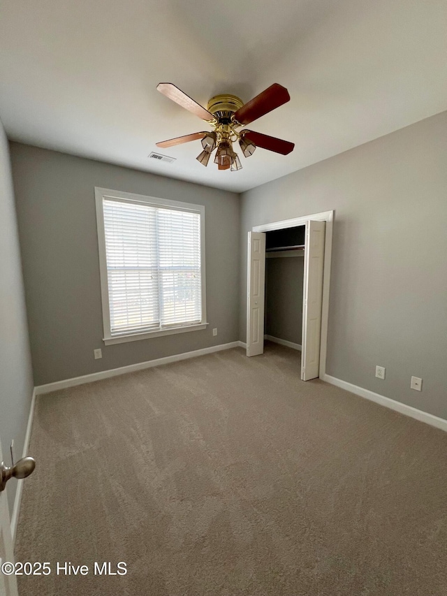 unfurnished bedroom featuring a closet, visible vents, and baseboards