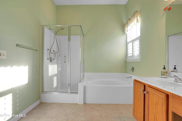 full bathroom with a shower stall, a garden tub, tile patterned flooring, and vanity
