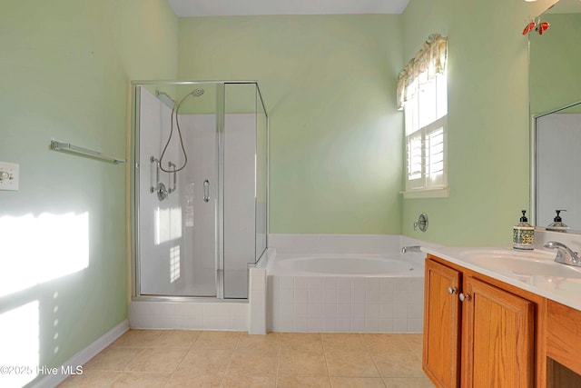 bathroom featuring a bath, tile patterned floors, vanity, and a stall shower