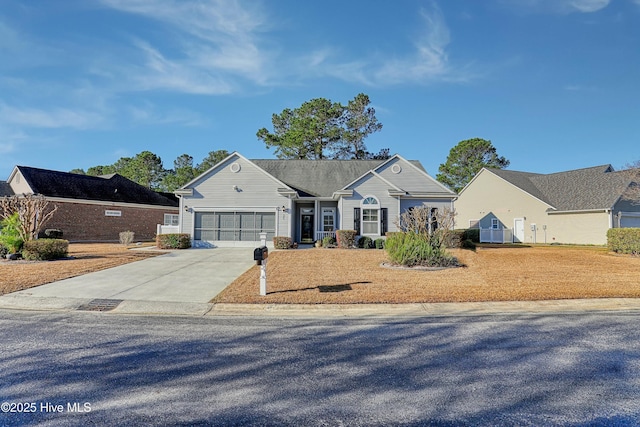 view of front of property featuring an attached garage and driveway