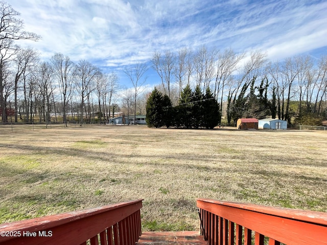 view of yard with an outbuilding and a storage unit