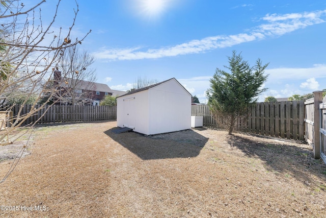 view of shed featuring a fenced backyard