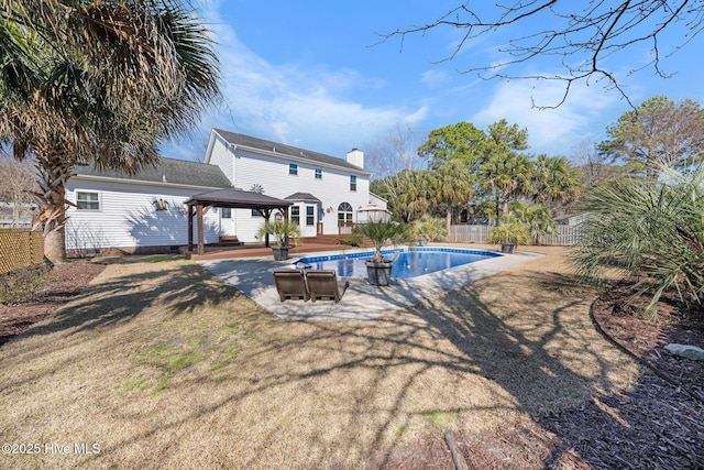 view of swimming pool with a fenced in pool, a lawn, a gazebo, fence, and a deck