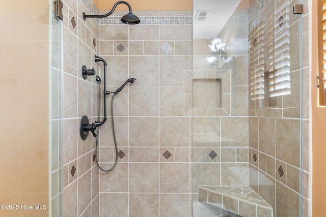 bathroom featuring a shower stall