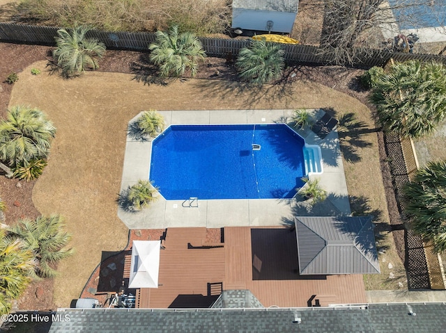 view of pool featuring fence