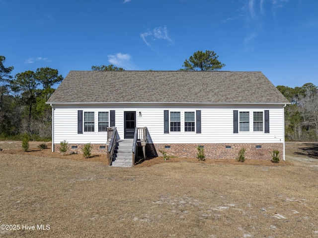 view of front of home featuring crawl space and roof with shingles