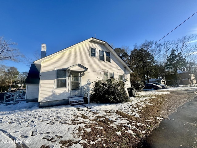 view of front of home with a chimney