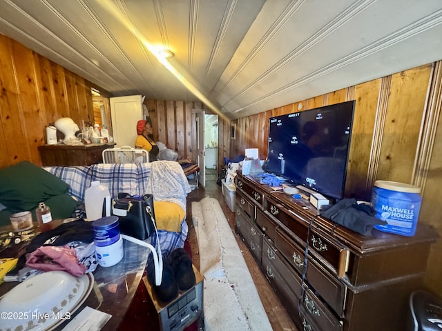 bedroom featuring wood ceiling and wood walls