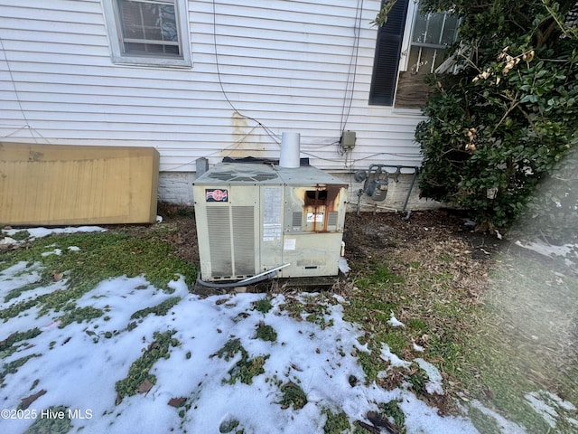 exterior details with gas meter and central air condition unit