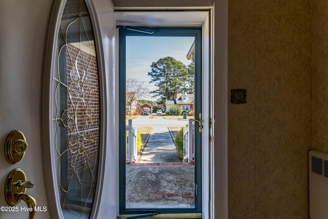 doorway featuring radiator heating unit