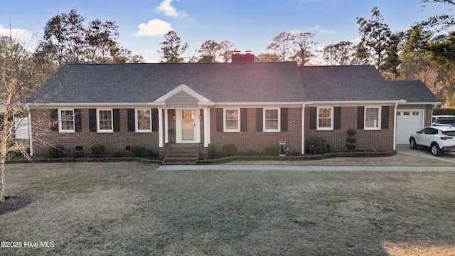 view of front of property with brick siding, a chimney, a garage, and roof with shingles