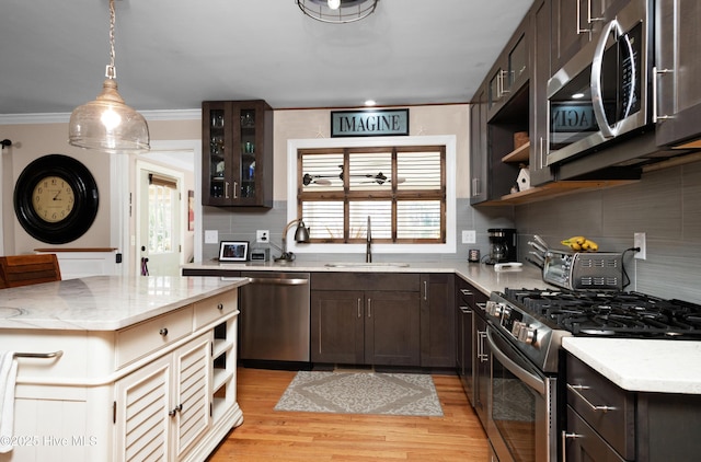 kitchen featuring stainless steel appliances, dark brown cabinets, and open shelves