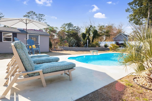 view of pool featuring a patio area and a fenced in pool