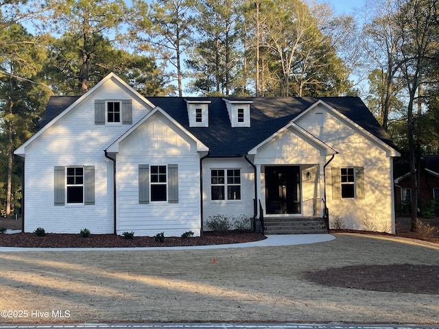 view of front of property featuring brick siding and board and batten siding