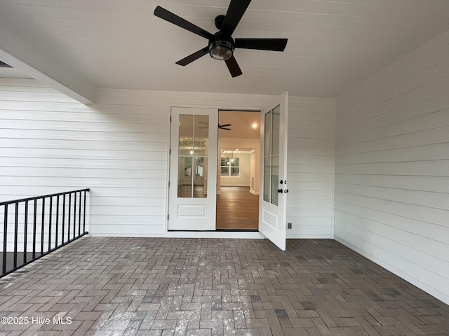 exterior space featuring a balcony and a ceiling fan