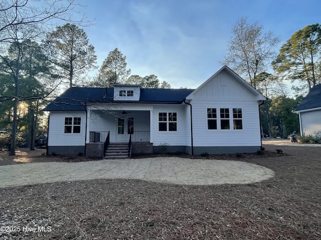 view of front of house with a porch and board and batten siding