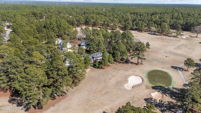 birds eye view of property with a view of trees