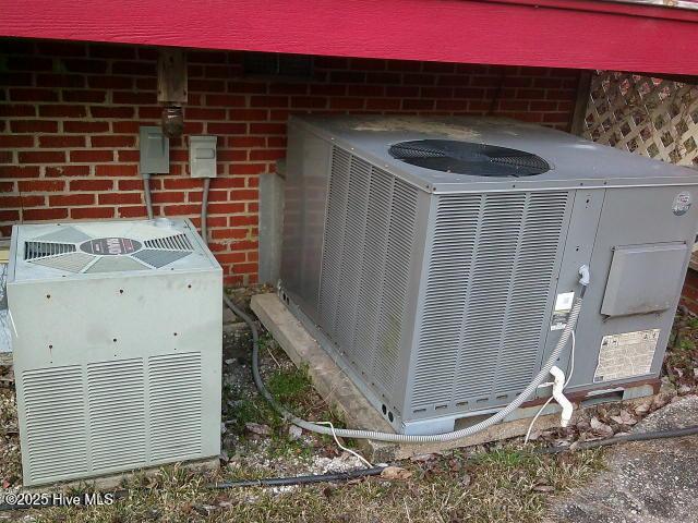 details with central AC and brick siding