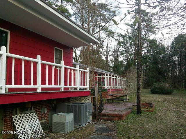 view of home's exterior featuring central air condition unit and brick siding